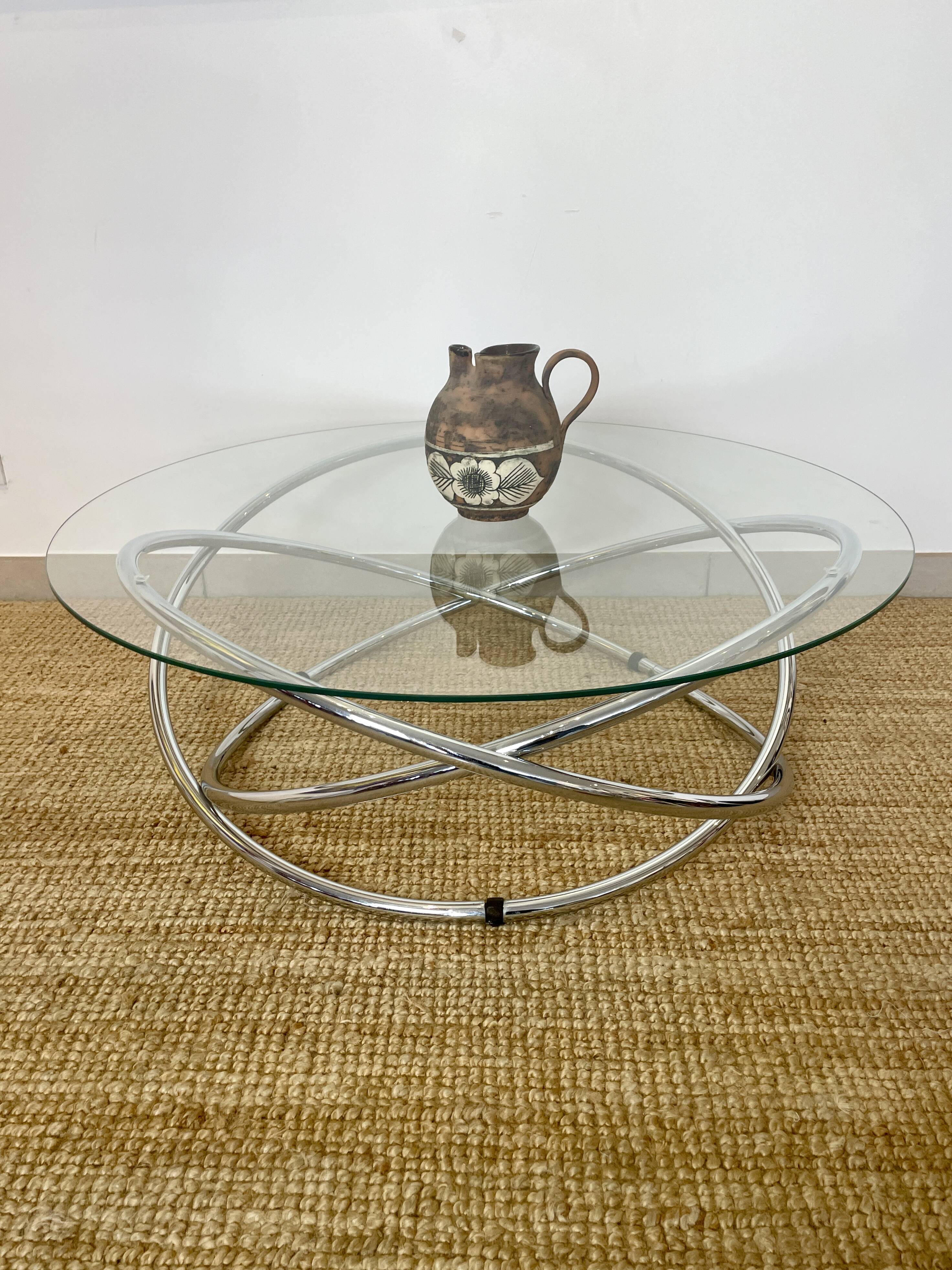 Coffee table with glass top and chrome tubular base