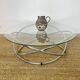 Coffee table with glass top and chrome tubular base