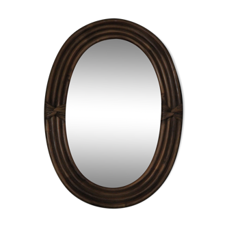 Oval mirror surrounded by braided rattan 37x52cm