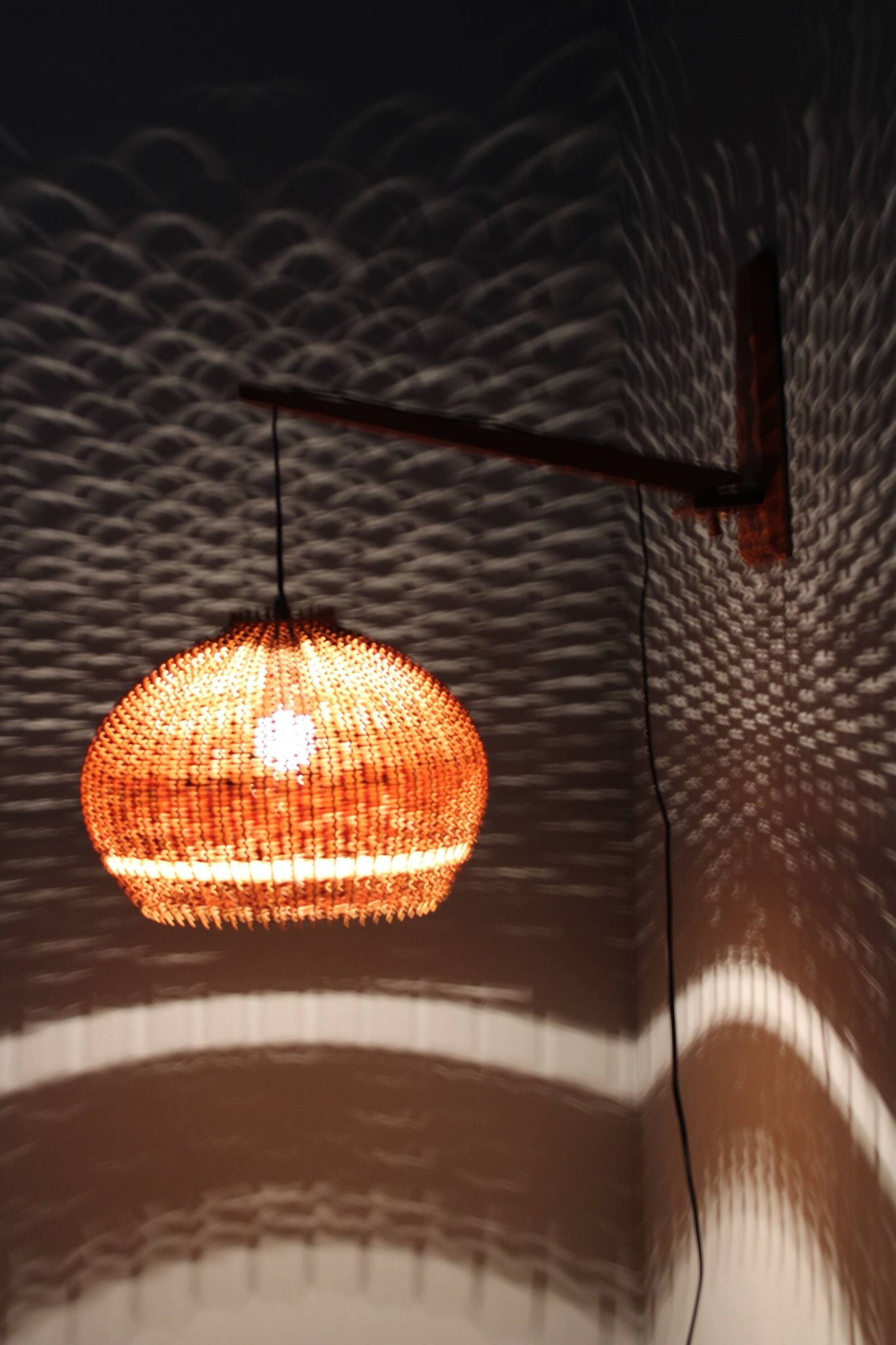 Adjustable mid-century wooden wall lamp with rattan shade, 1970s