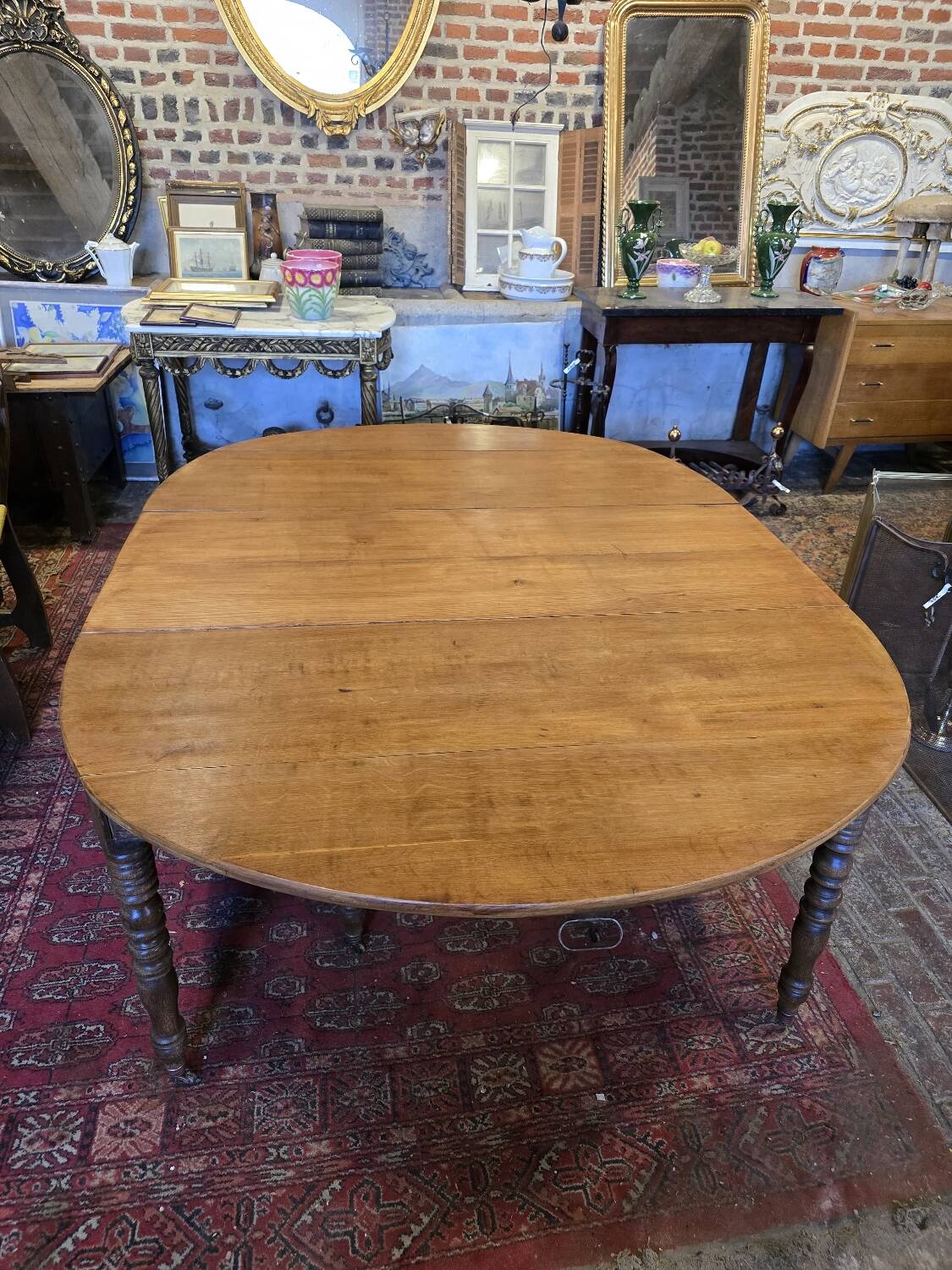 12-foot round oak table with 7 extensions / 20 people