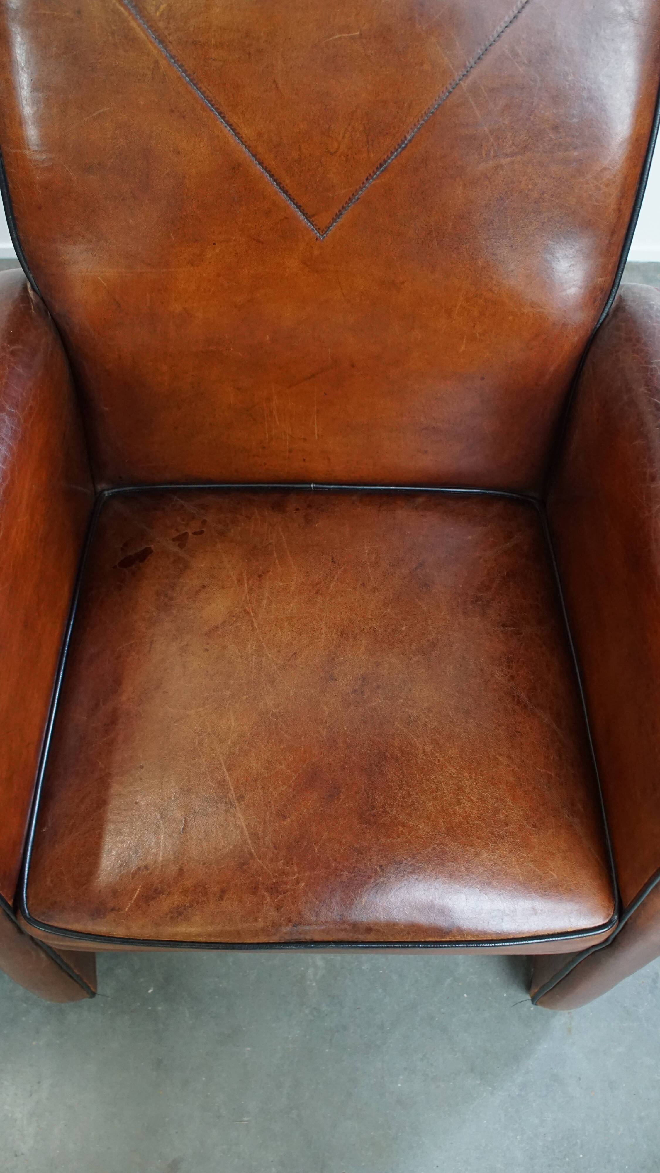 Vintage set of 4 sheepskin leather dining chairs on castors