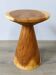 Minimalist side table in solid suar wood with conical legs.