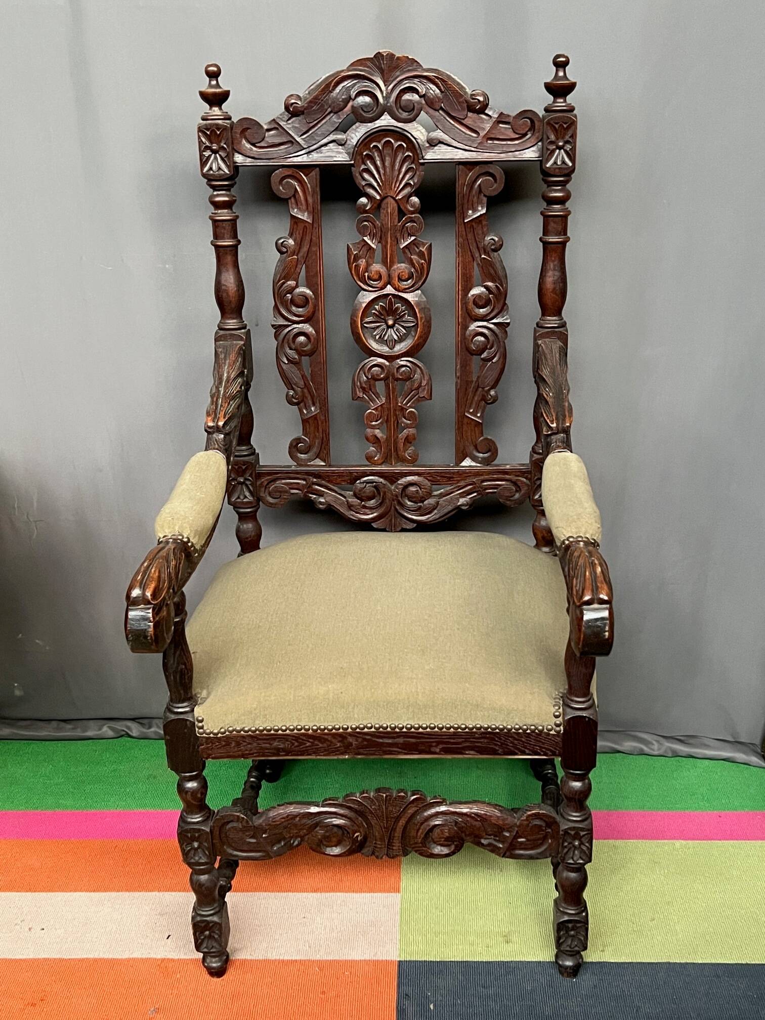 Renaissance-style oak armchair, hand-carved deep sculpture.