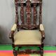 Renaissance-style oak armchair, hand-carved deep sculpture.