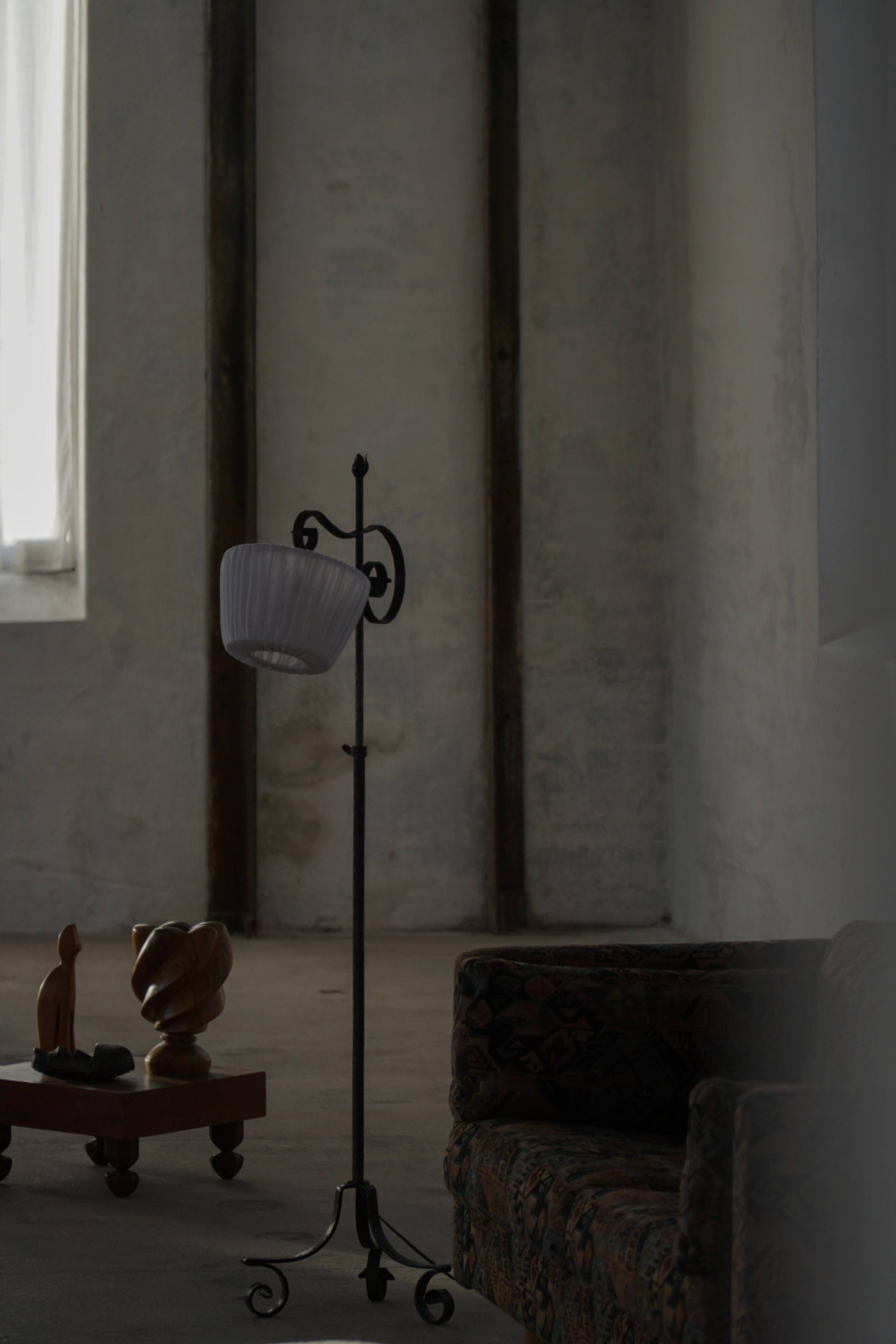 20th-century wrought iron floor lamp with swirling detail, Danish Art Deco.