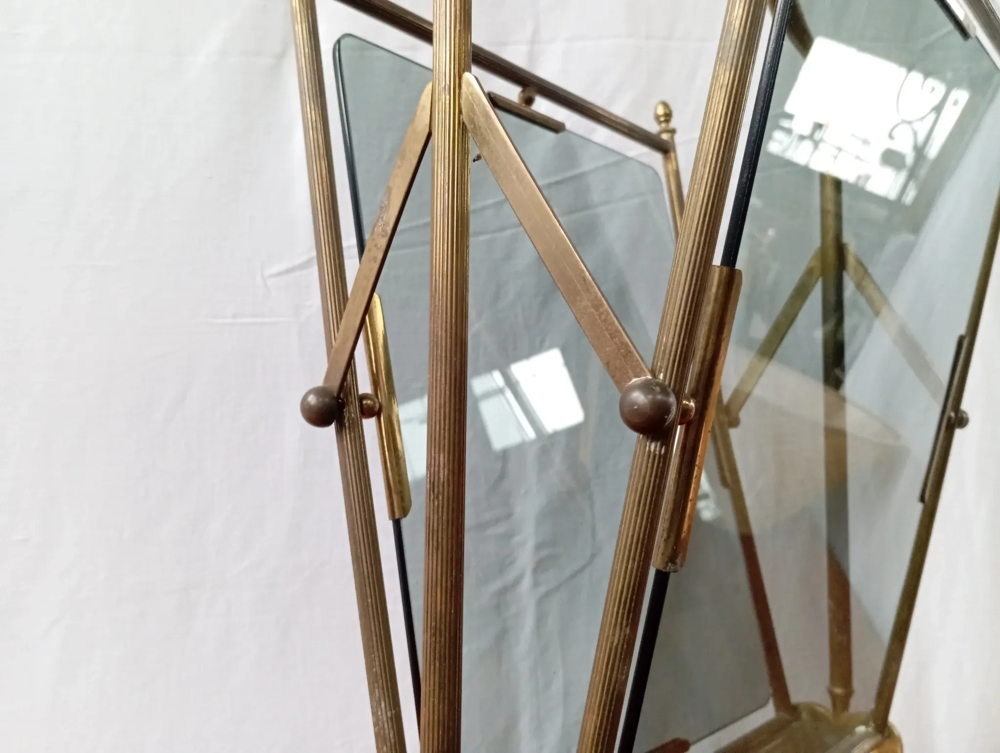Neo-classical brass magazine rack in the spirit of Maison Jansen.