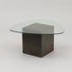 Unique design coffee table with natural stone base and organic glass top