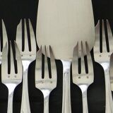 12 cake forks and a silver metal server.