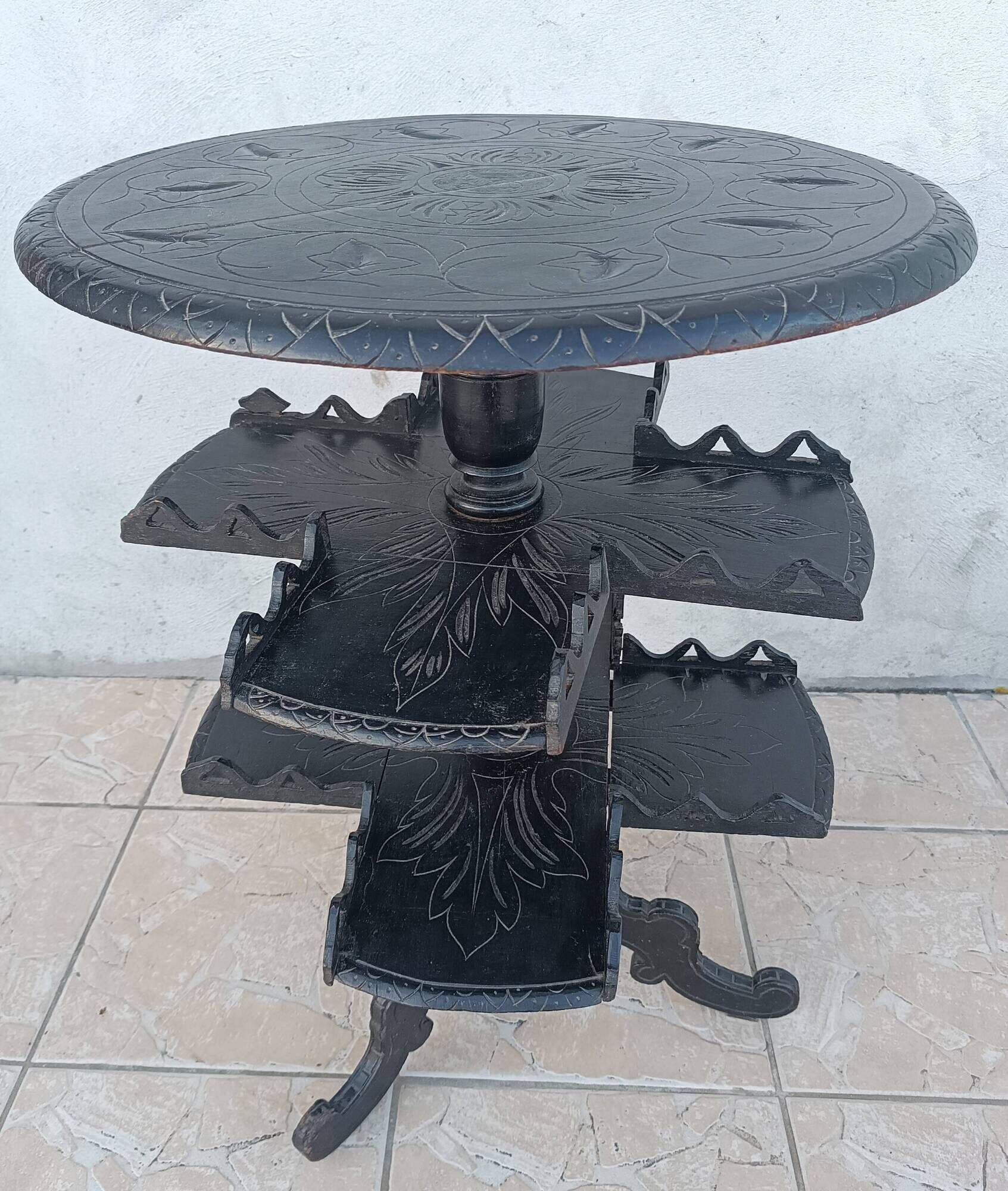 Napoleon III period gueridon in blackened wood.