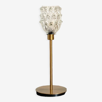 Table lamp with an antique glass lampshade in the shape of a tulip