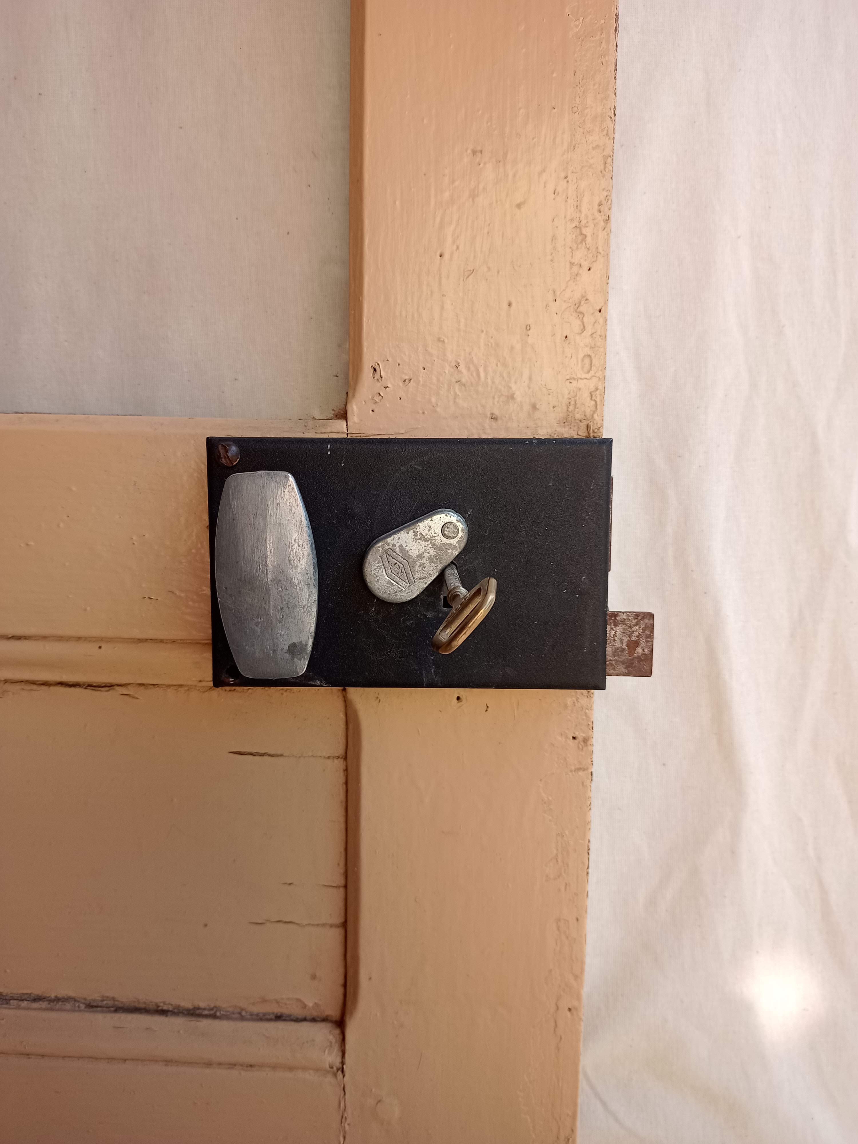 Old glazed door with its shutter