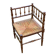 19th-century solid wood corner chair with red and blue rush seating.