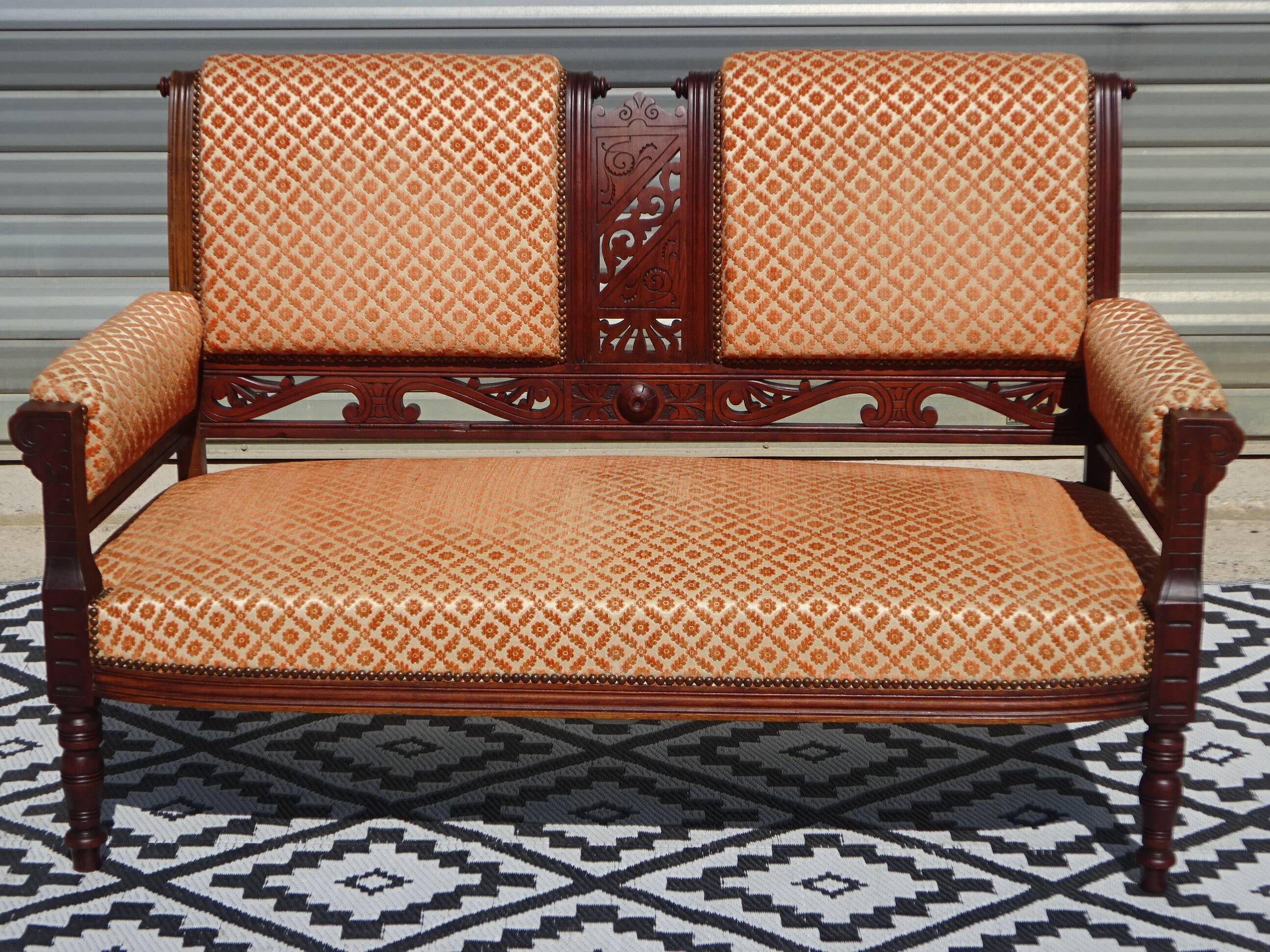 Old wooden and velvet bench