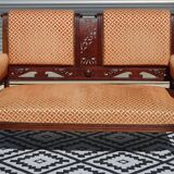 Old wooden and velvet bench