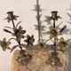 Pair of church candlesticks in bronze with floral decorations.