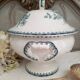 Old mismatched hollow plates in iron earth earthenware accompanied by a soup tureen