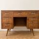 Vintage Scandinavian desk in waxed wood with 7 drawers.