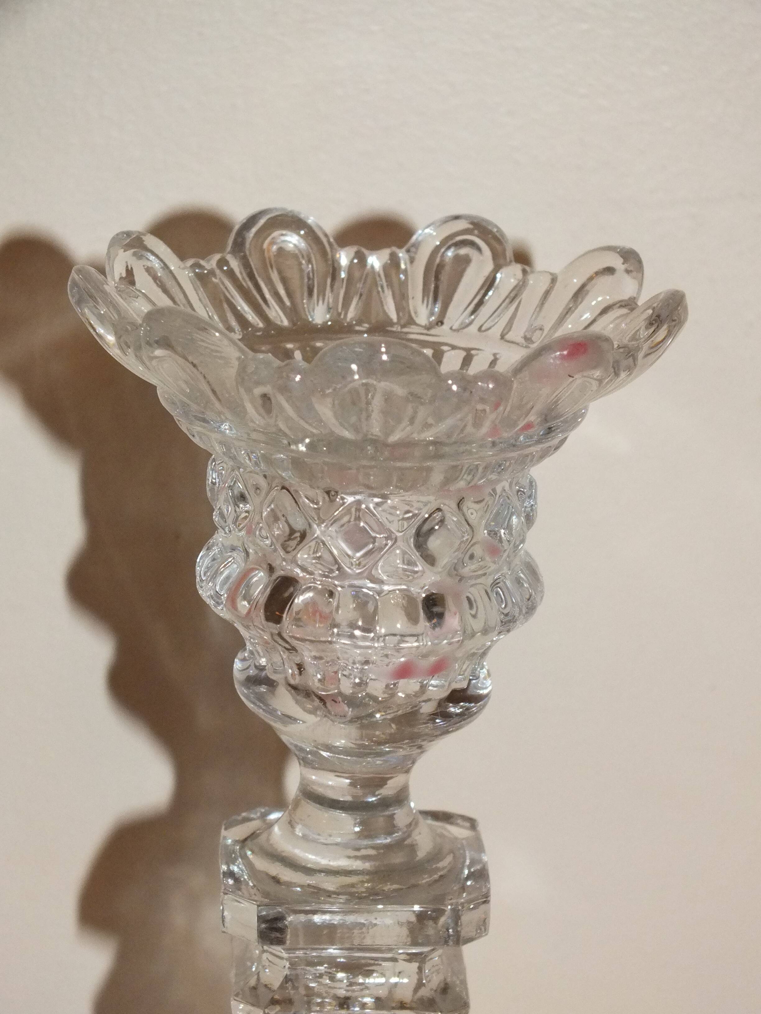 19th century candlestick in molded glass decorated with roses and lions
