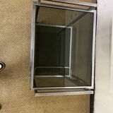 1970s coffee table in brass with a double smoked glass top.