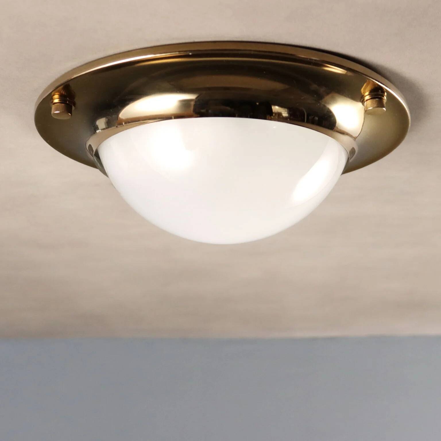 Vintage wall light in aluminium, brass, and glass, 1970s design.