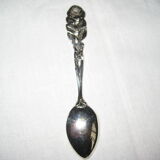 silver metal sugar and silver sugar spoon.