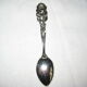 silver metal sugar and silver sugar spoon.
