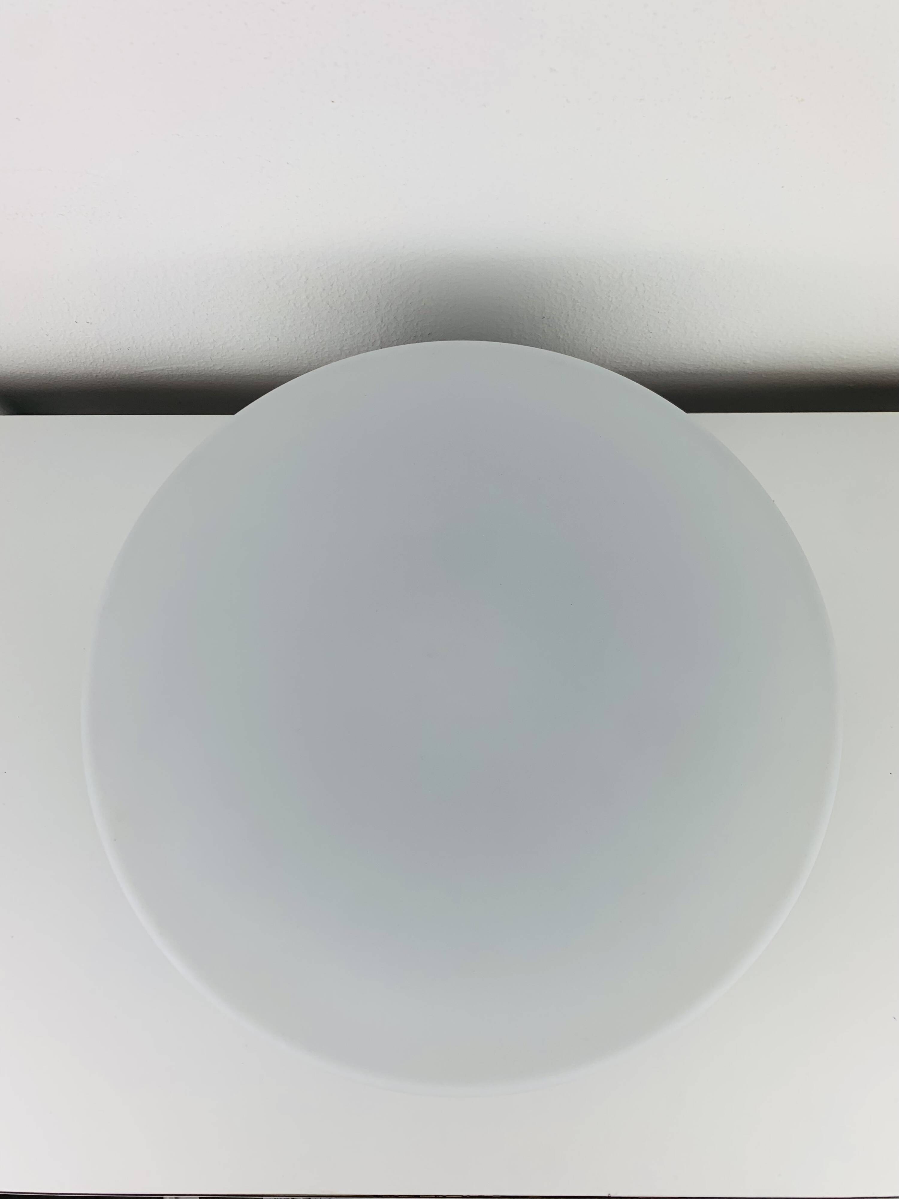 Erco round opaline wall light from the 1960s