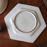 Ancient hexagonal plate in earthenware with polychrome floral decoration.