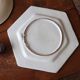 Ancient hexagonal plate in earthenware with polychrome floral decoration.