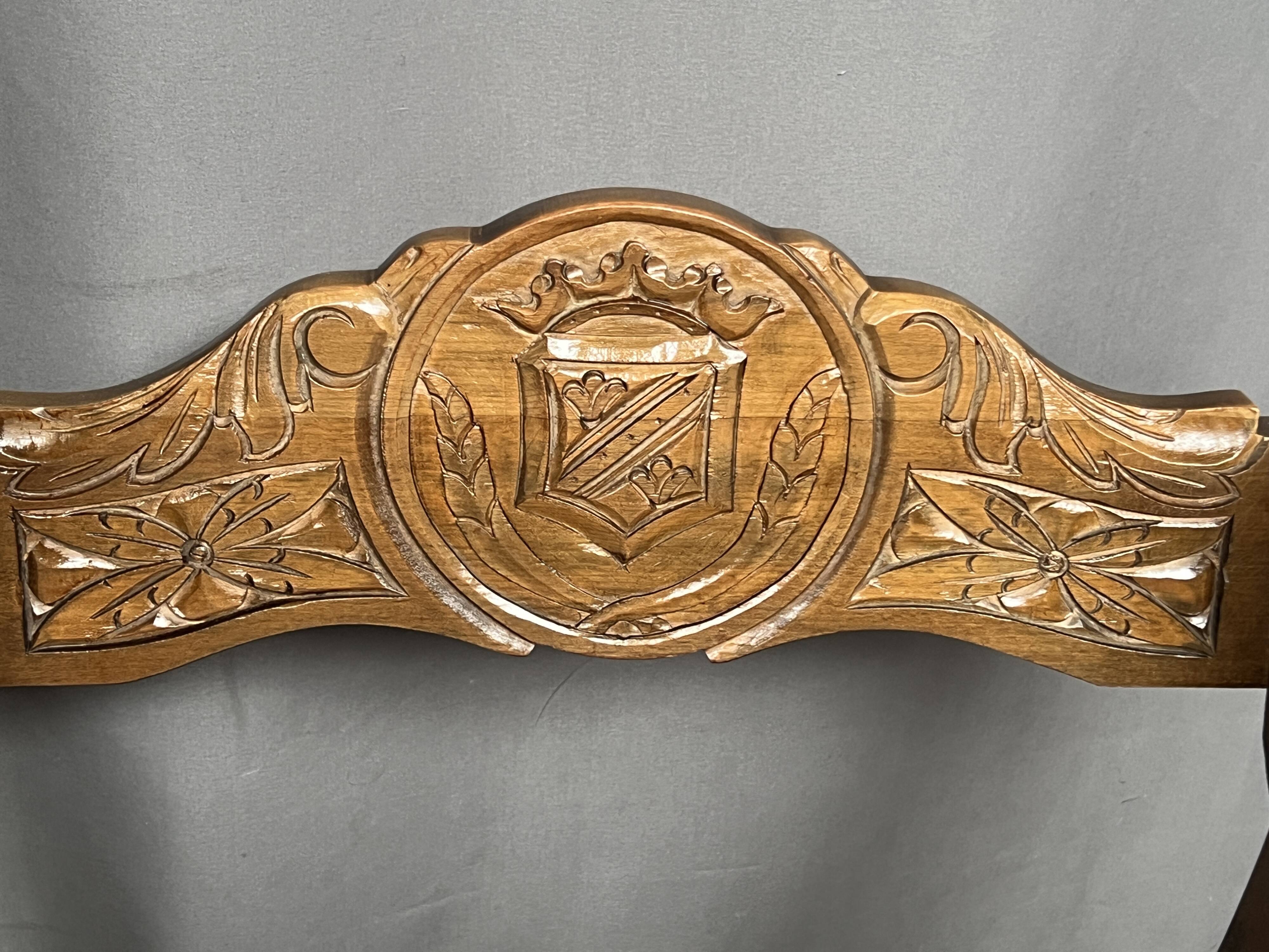 Dagobert style armchair. Solid walnut, leather.