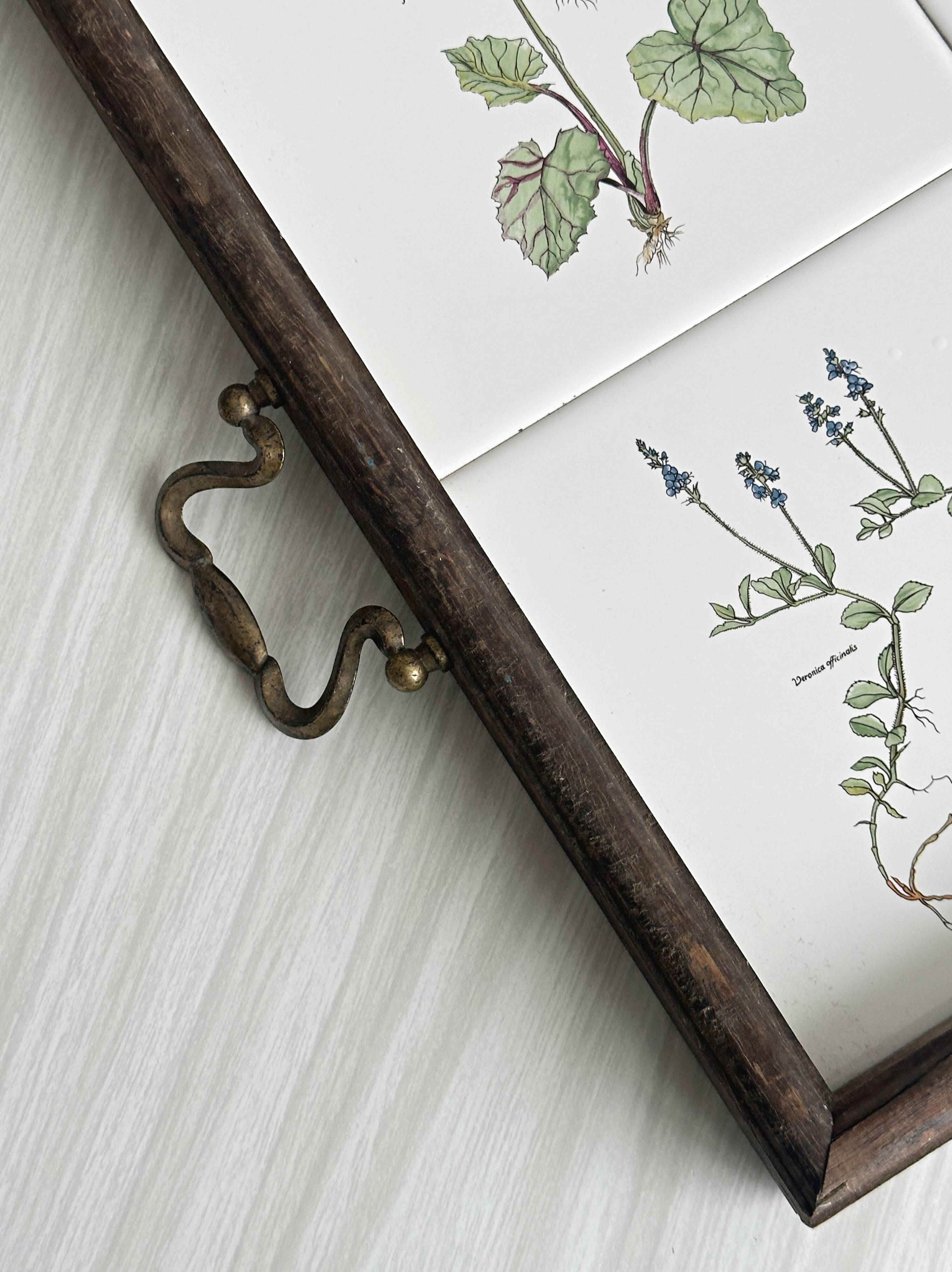 Old wooden plateau with floral tiles