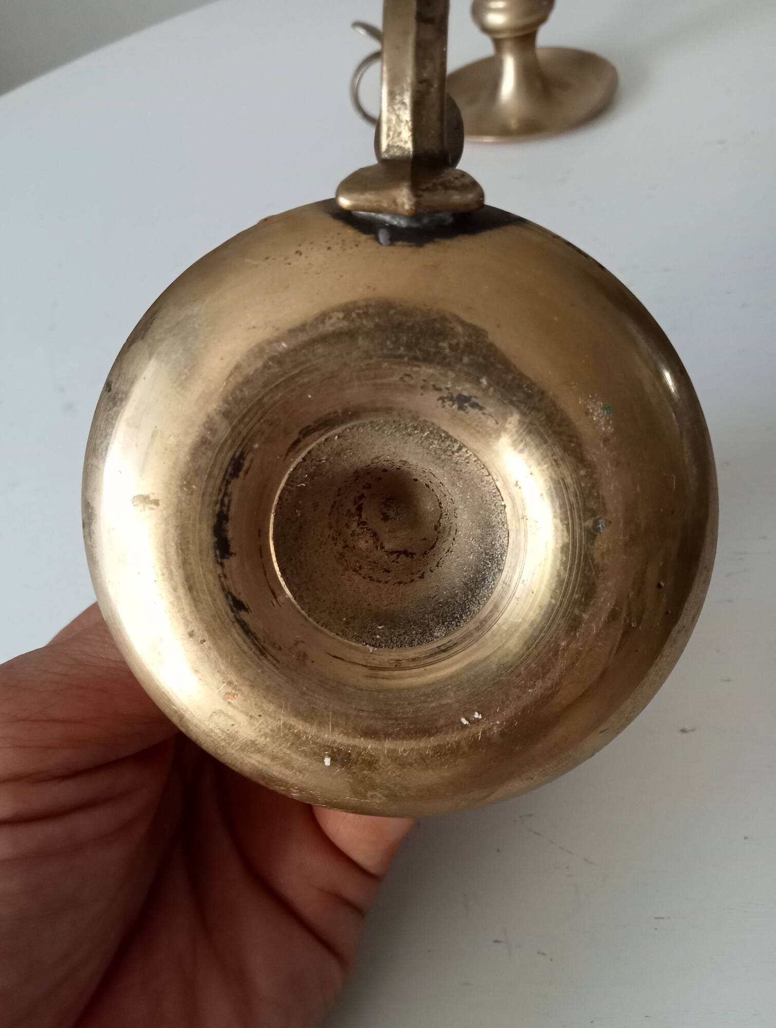 Antique hand candlestick in solid gilded brass.