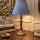 Vintage bedside lamp in gold metal – sculpted base and blue shade
