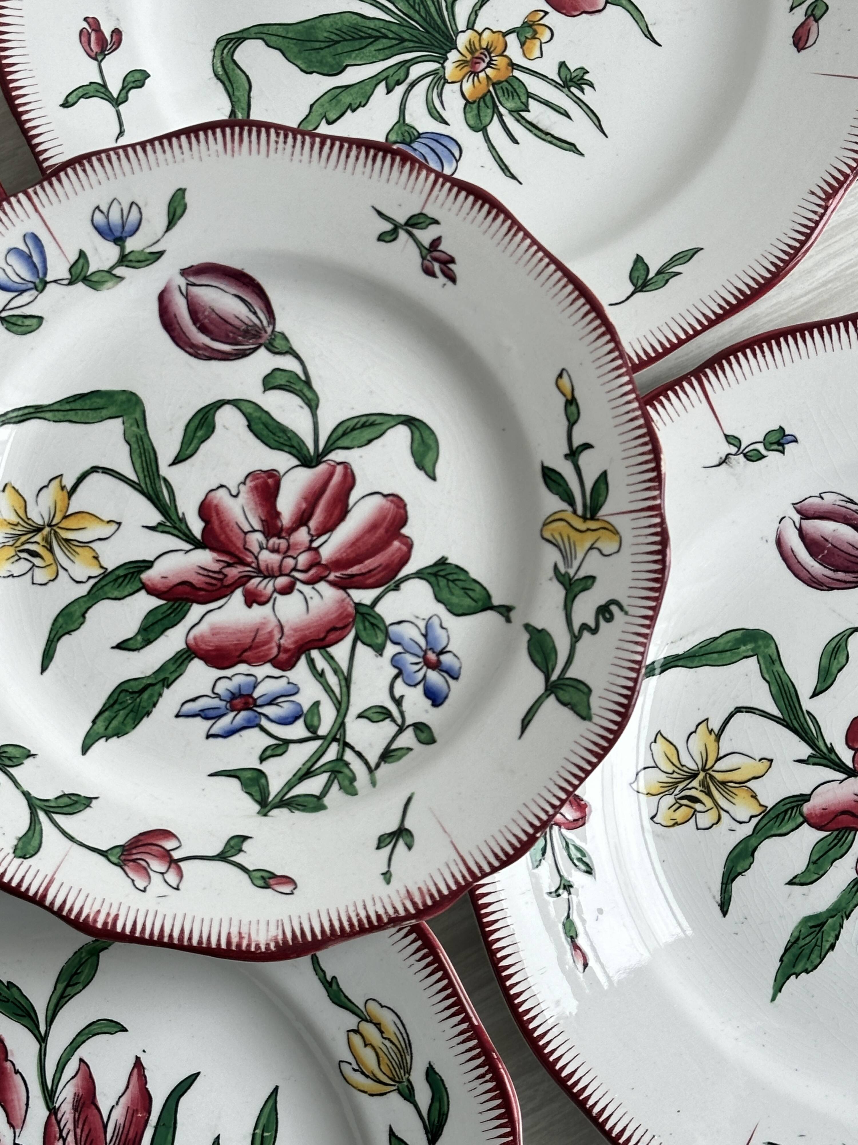 5 plates with colorful Sarreguemines floral designs.