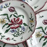 5 plates with colorful Sarreguemines floral designs.