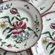 5 plates with colorful Sarreguemines floral designs.
