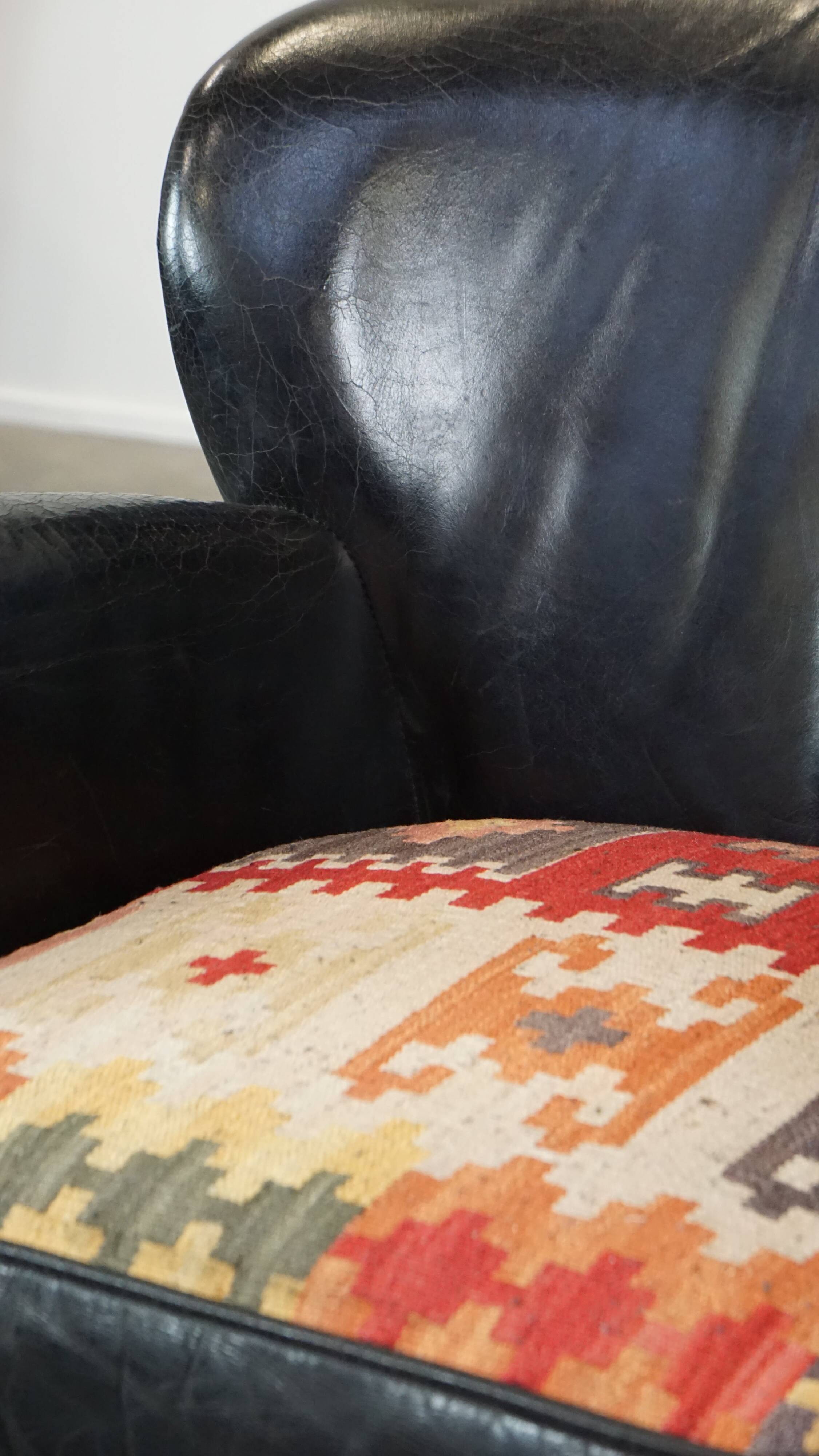 Fauteuil en cuir de vachette noir