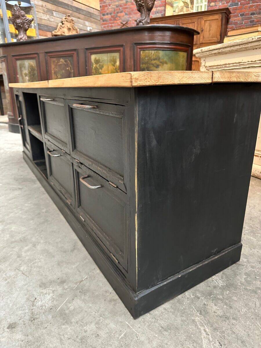 Old workshop furniture transformed into a TV unit.