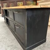 Old workshop furniture transformed into a TV unit.