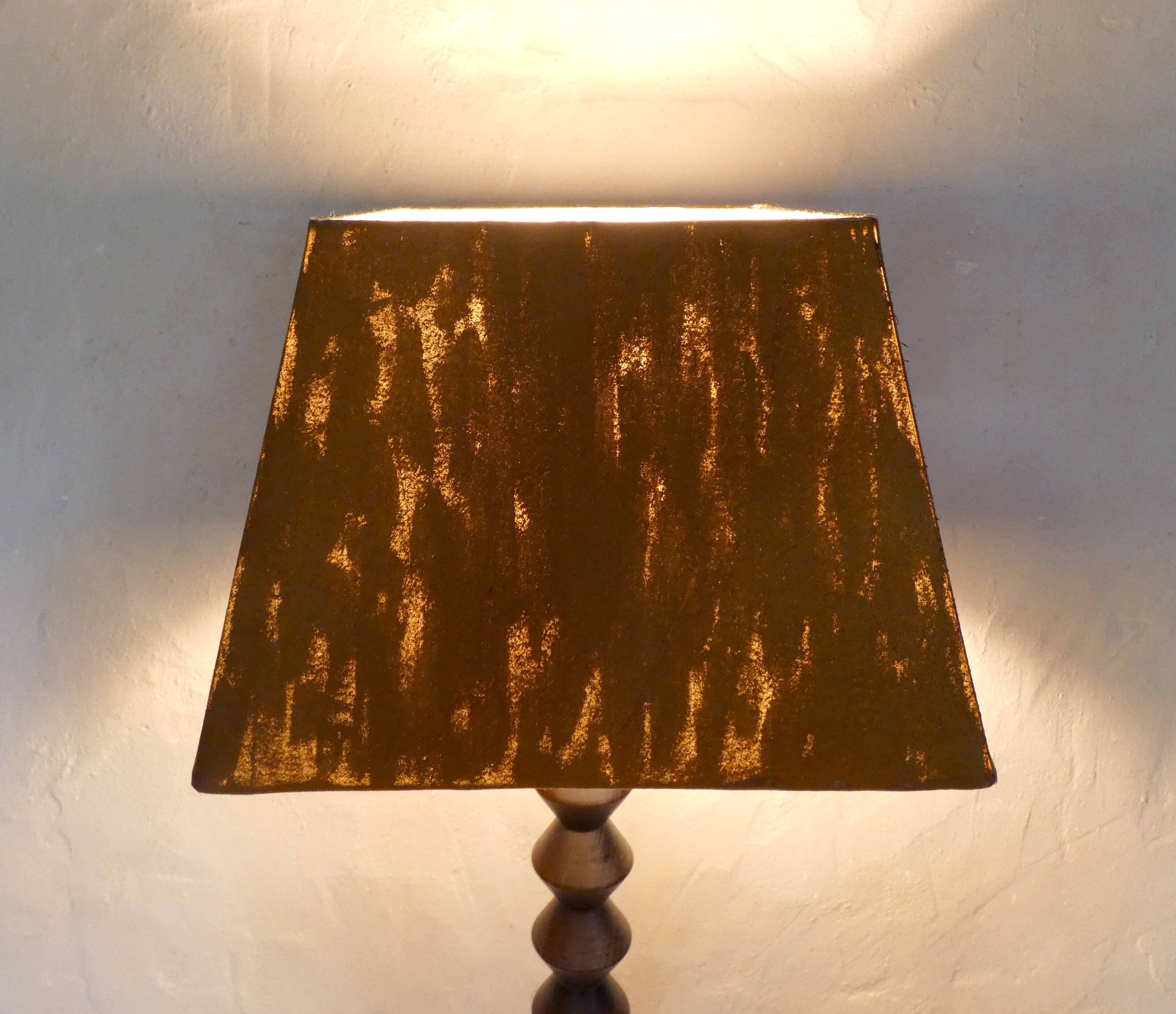 turned wooden lamp with spool base and vintage copper shade