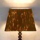 turned wooden lamp with spool base and vintage copper shade