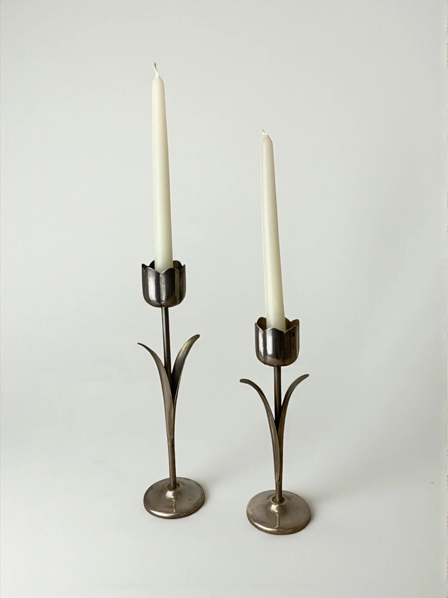 Pair of chromed tulip candle holders, 1970s, Italy