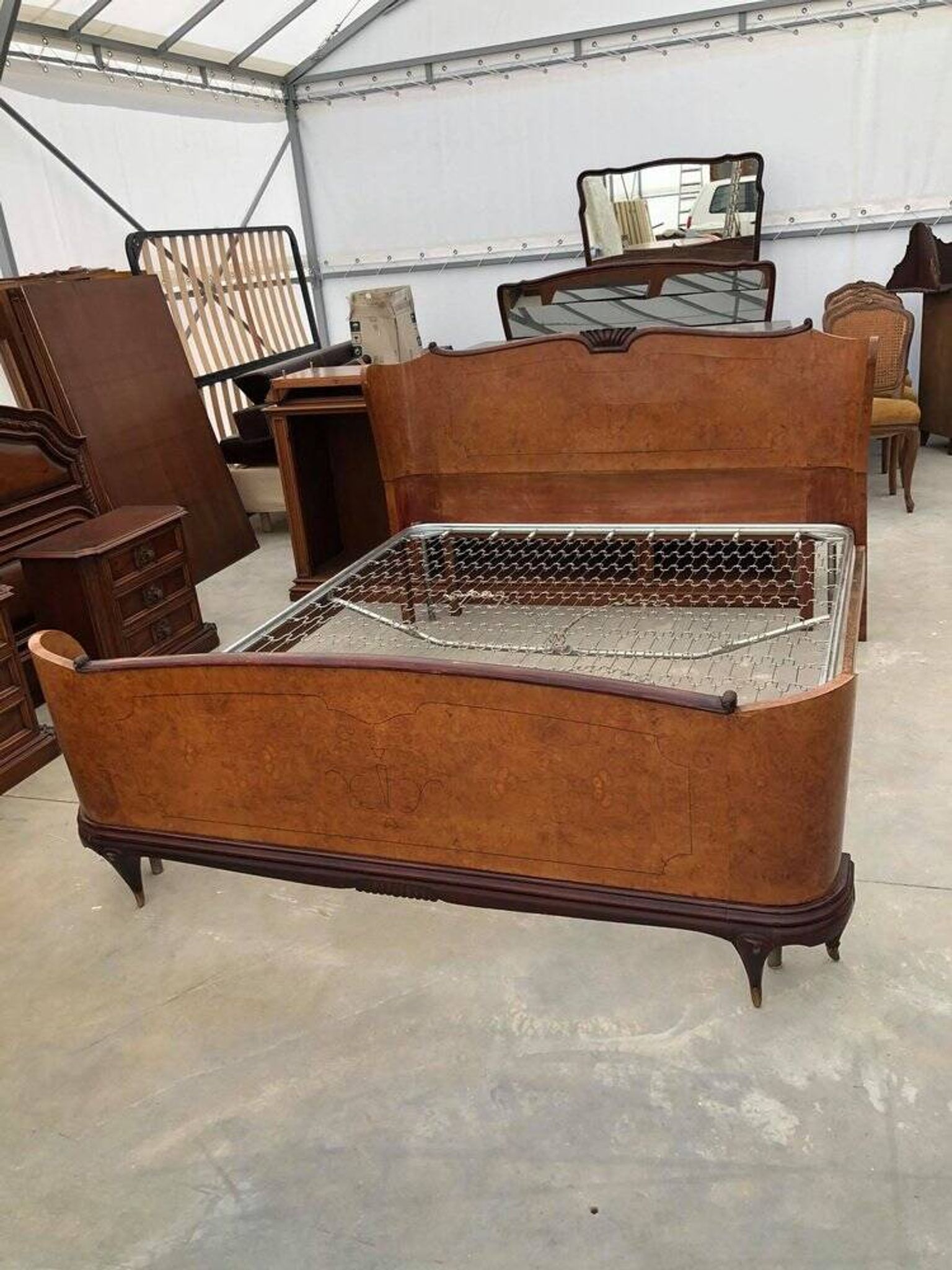 Brown lacquered wooden double bed frame in Mid-Century style from the 1940s.