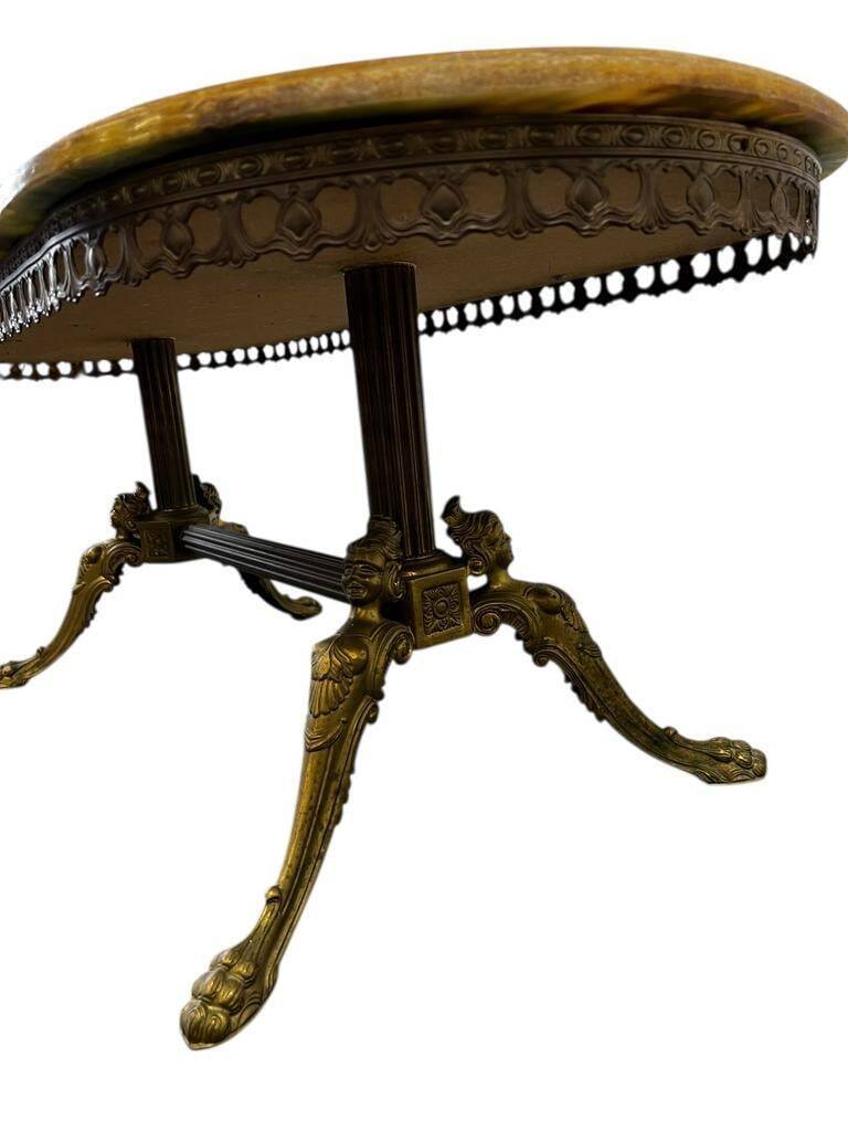 Vintage onyx coffee table with brass frame.