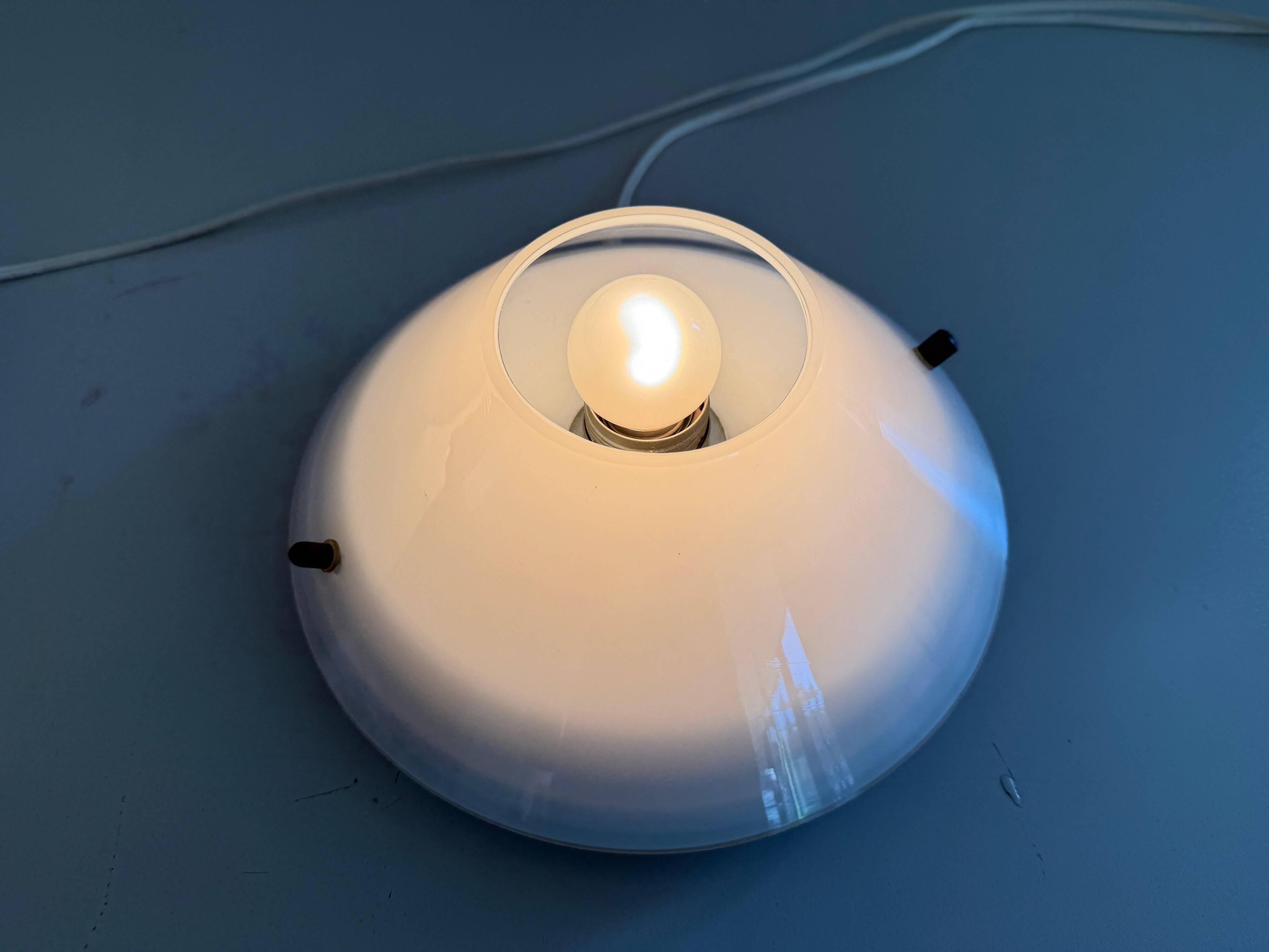 Pair of opal glass wall lights from the mid-century by Lamperti, 1960s, Italy.