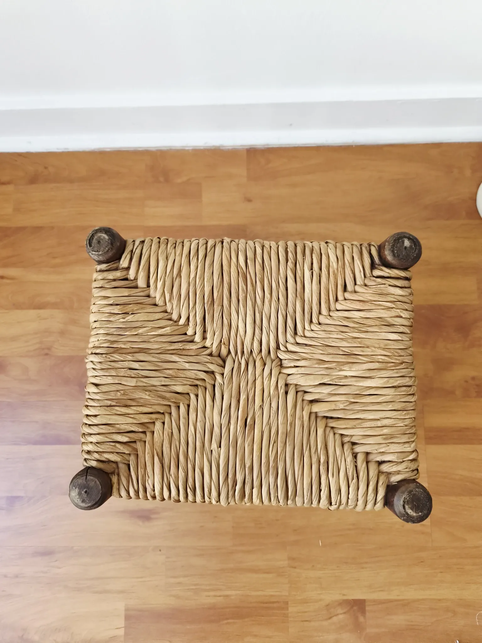 Small rustic vintage wooden and straw stool -