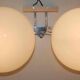 Pair of 60s wall lights in metal and opaline