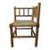 Antique corner chair by the fire with turned wood and straw seat.