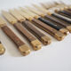Set of old dessert cutlery in wood and brass